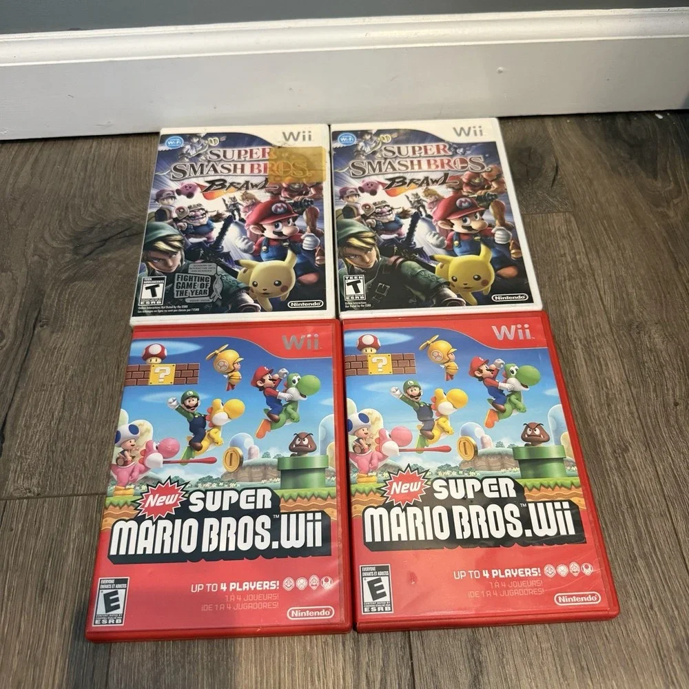 Lot of 4 Nintendo Video Games New Super Mario Bros Wii & Super Smash Bros Brawl